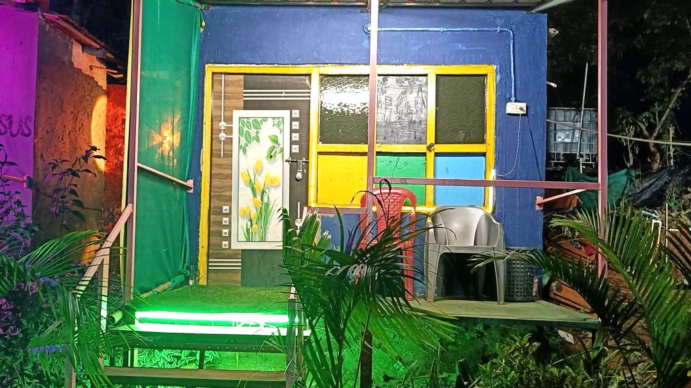 Rayudu Resort's veranda and cafe lit at night