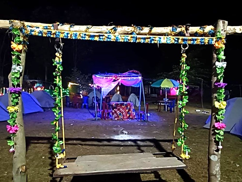 Camp tents lit up at night